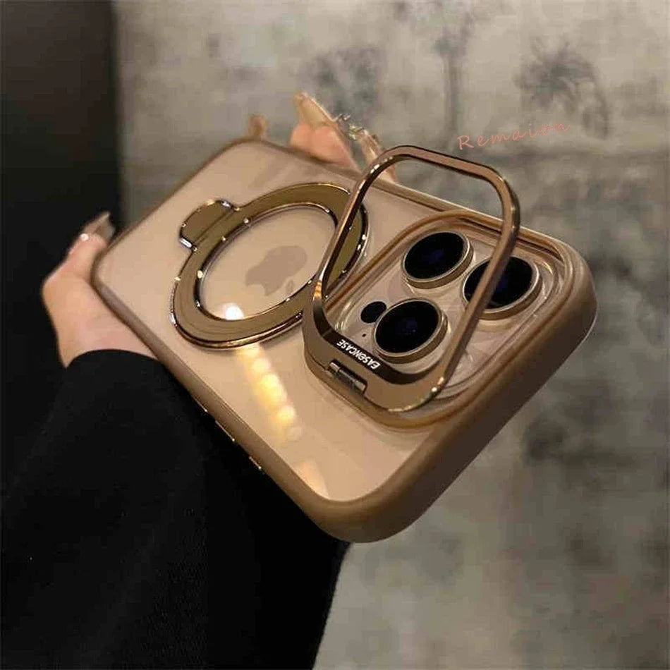 Gold phone case with ring holder held by a hand against a blurred background