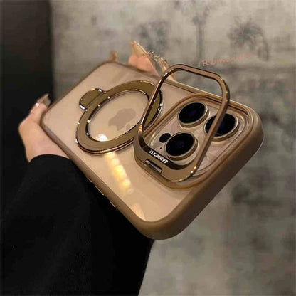 Gold phone case with ring holder held by a hand against a blurred background