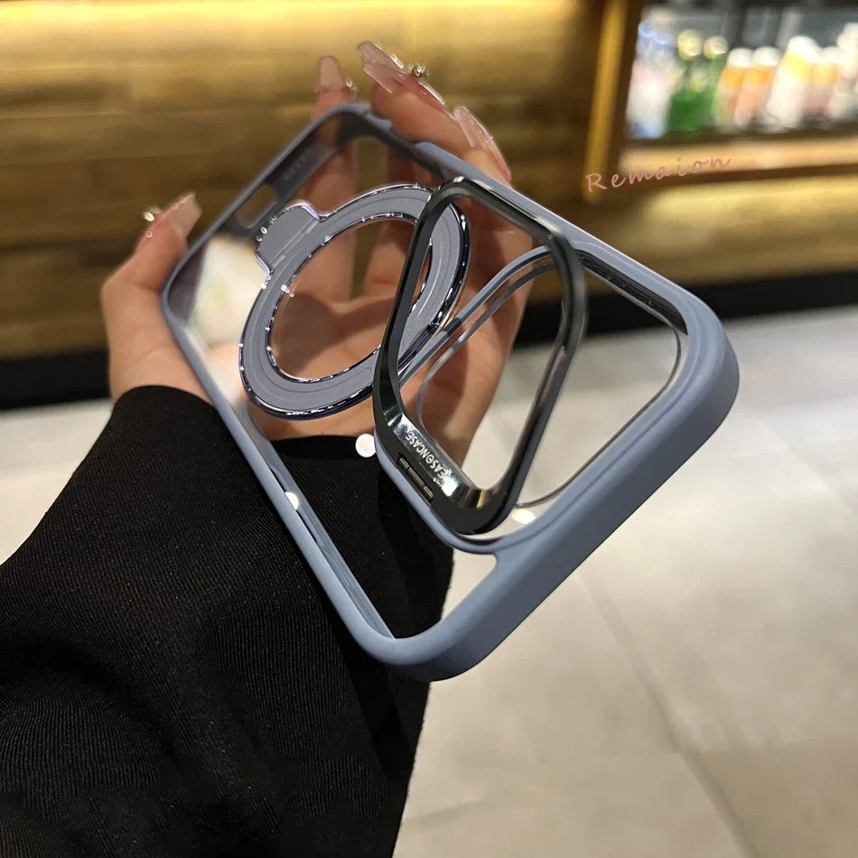 Phone case with ring holder held by a person in a blurred indoor setting